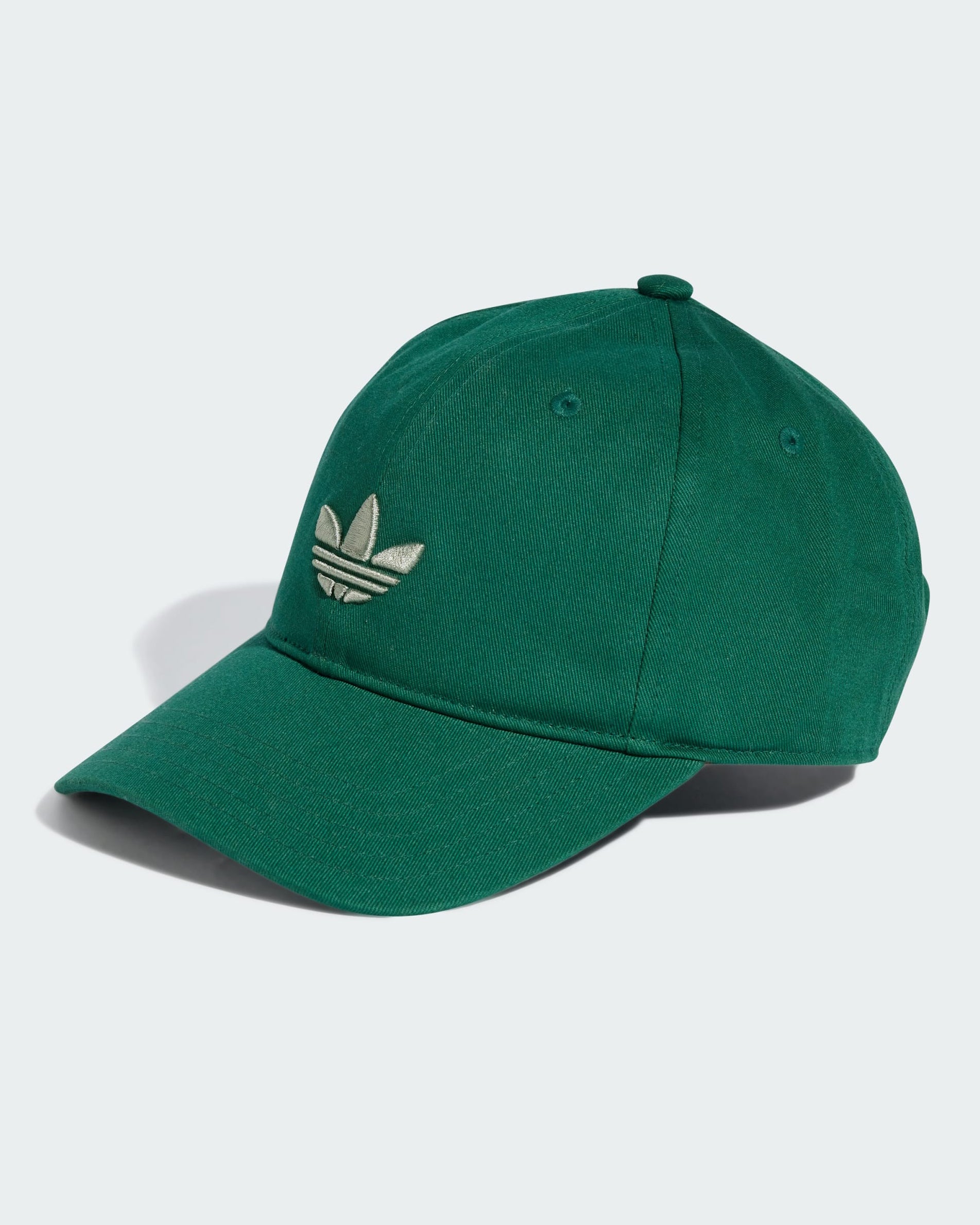 Green Adidas baseball cap with embroidered Trefoil logo on the front, curved brim, and ventilation eyelets on the crown.