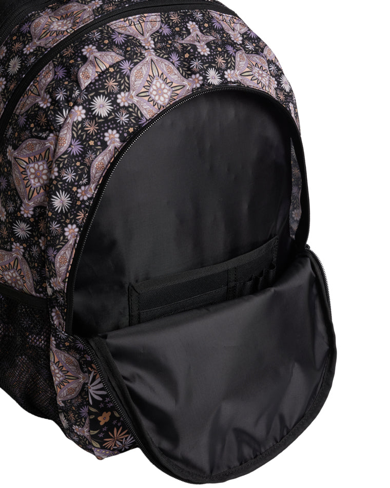 Open view of front pocket with interior organiser in patterned backpack.