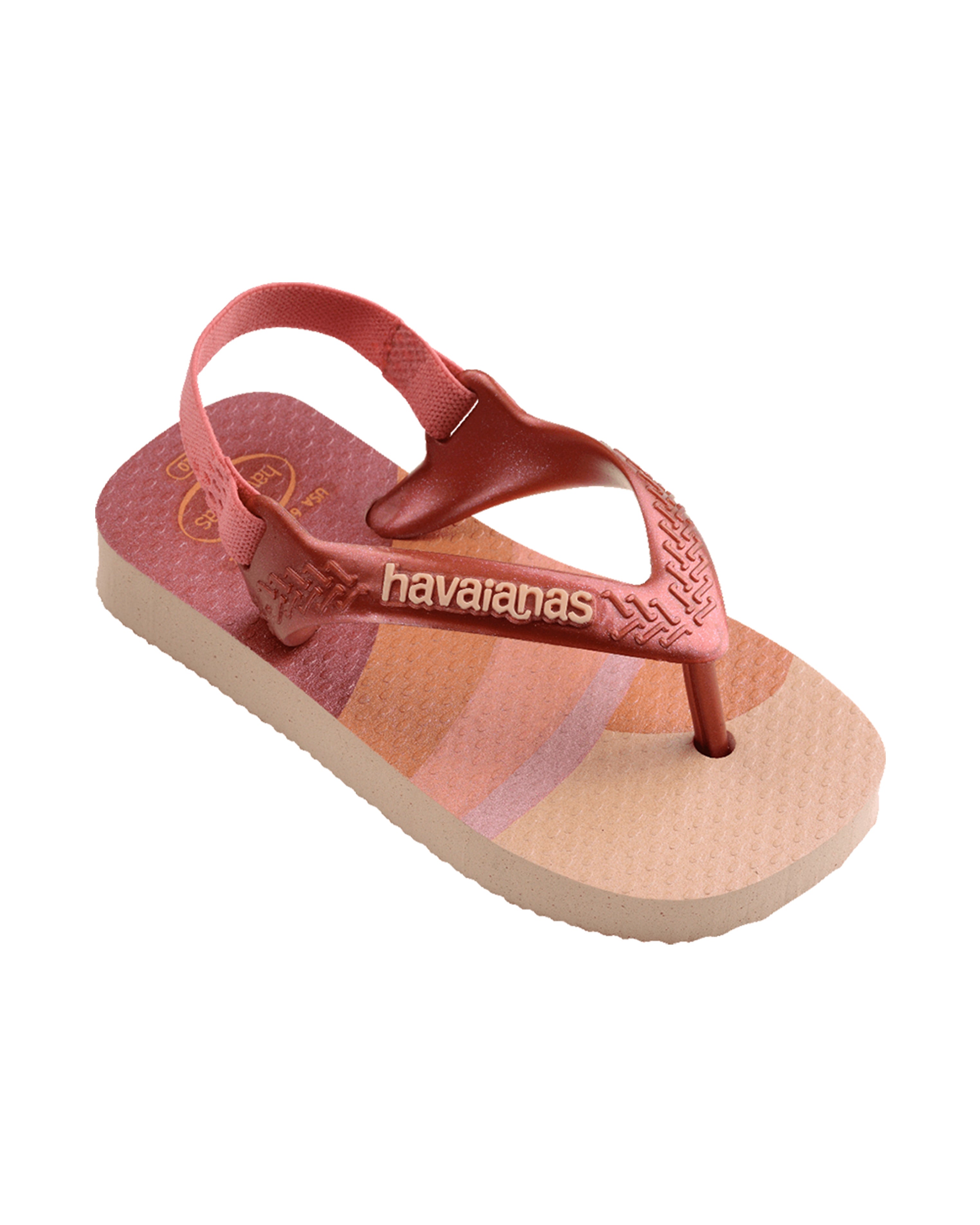 Side view of Havaianas flip-flop with textured footbed, pink and beige sole, and woven straps