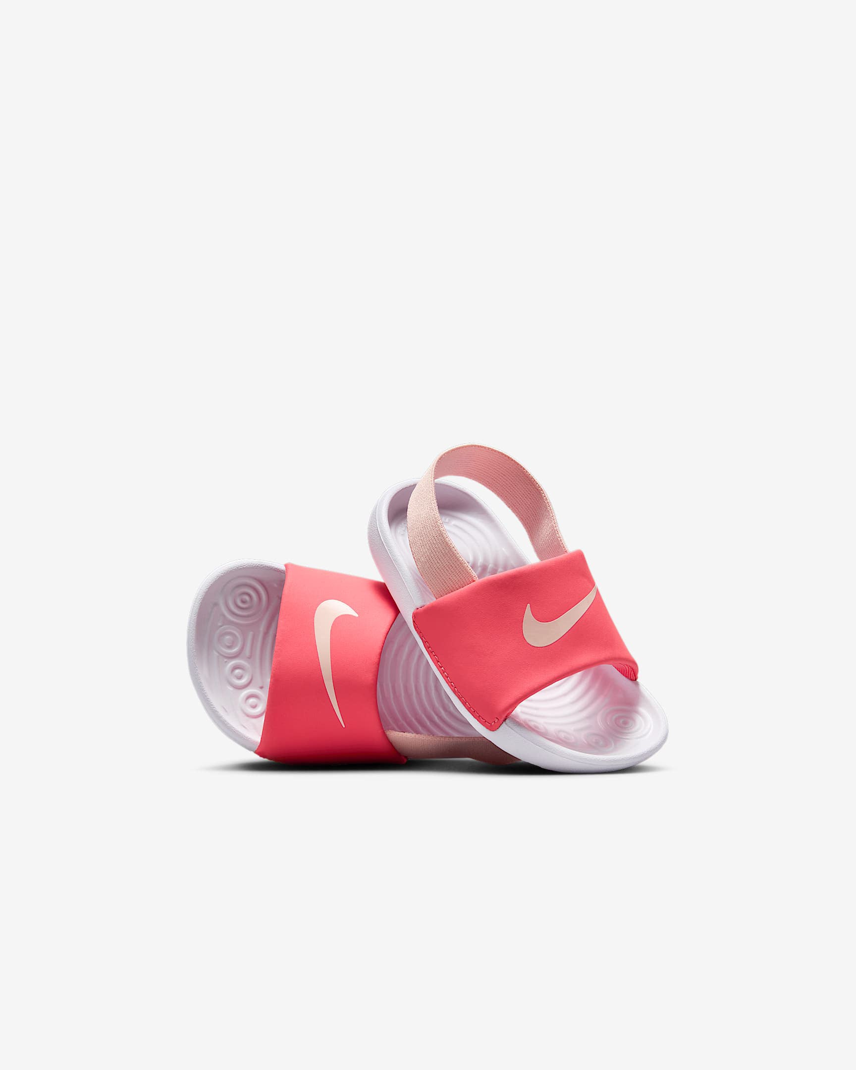 Pink and white Nike toddler sandals with wide strap and slingback elastic heel band.