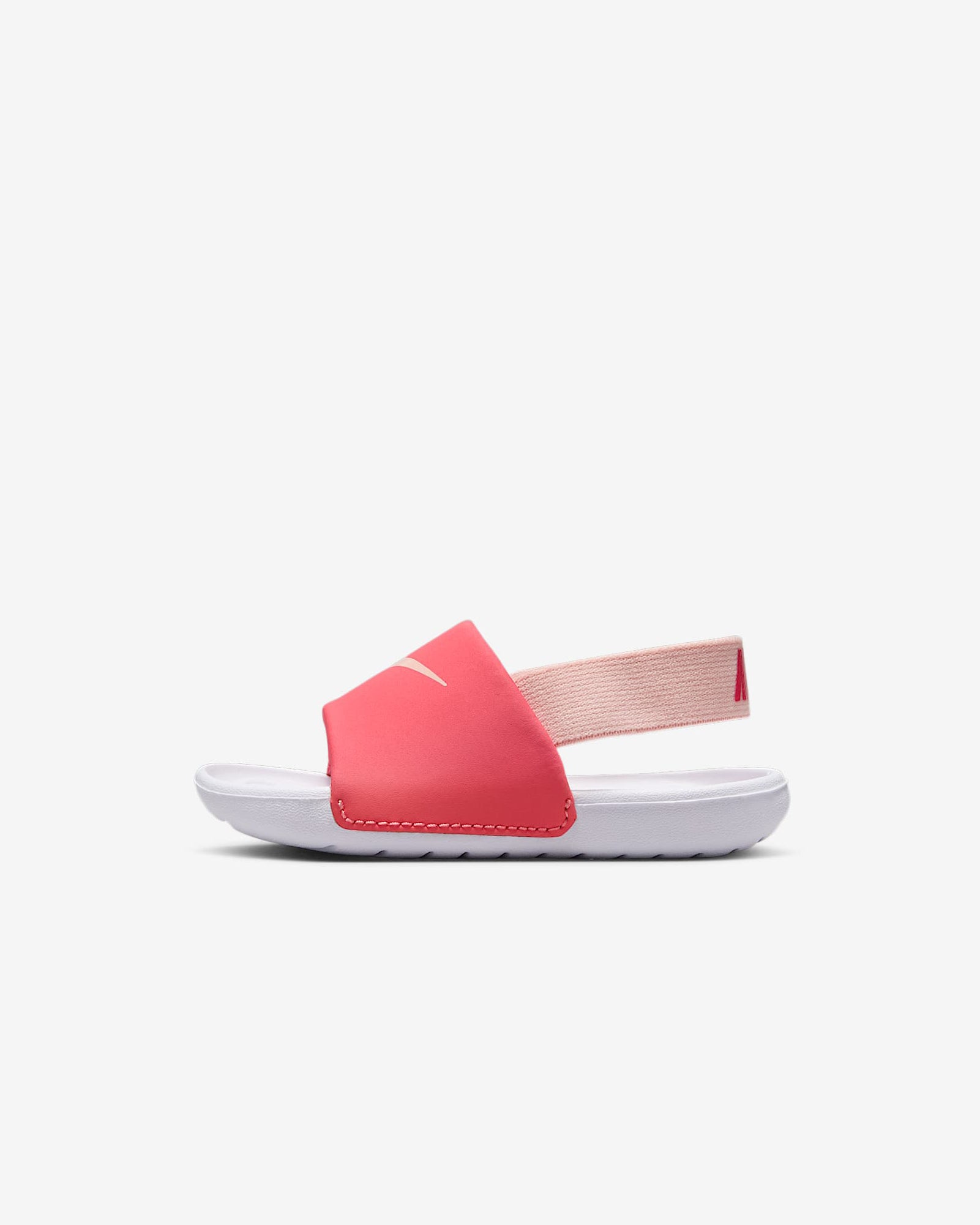 Side view of toddler Nike sandals showing pink strap and white sole with elastic back band.
