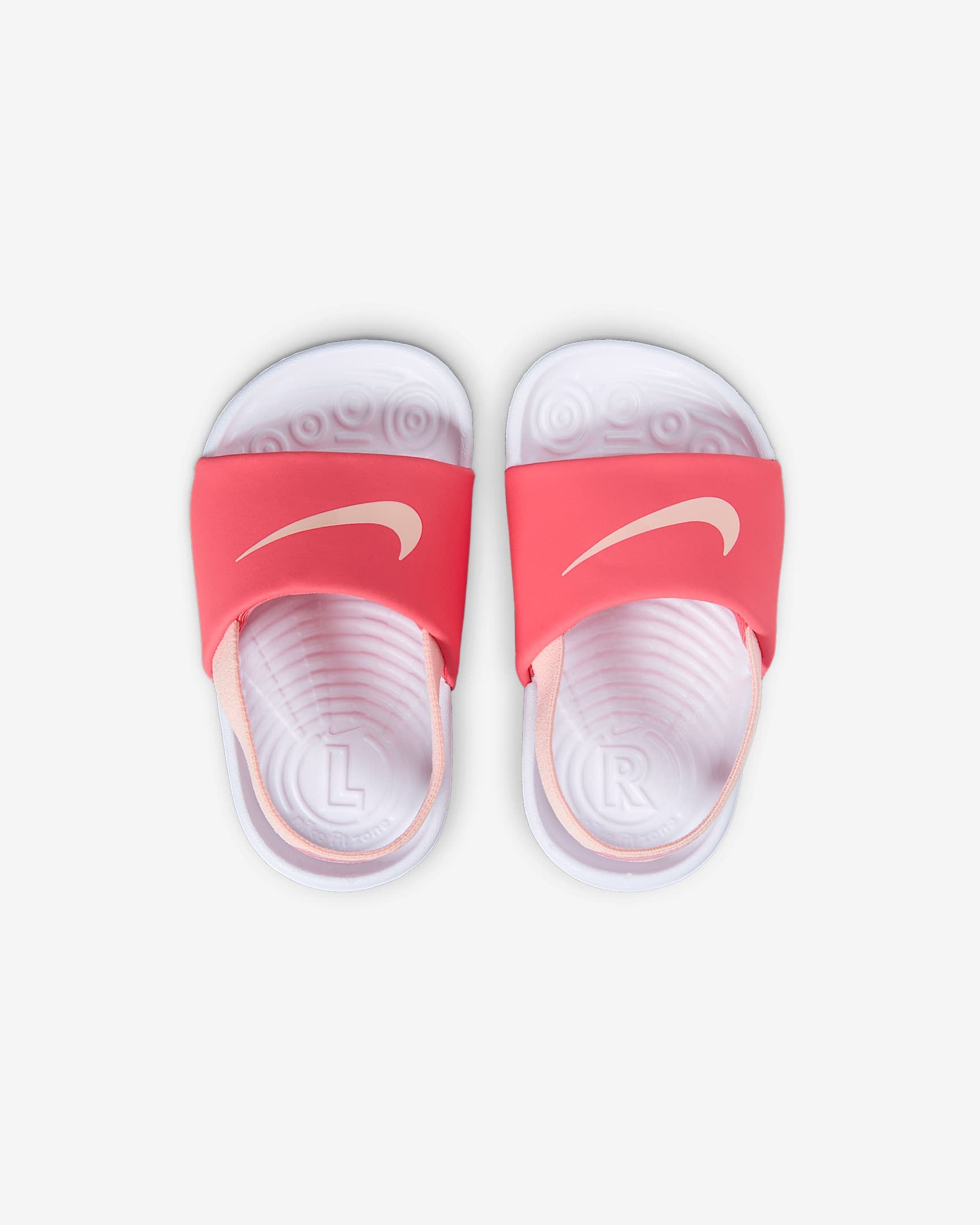 Top view of Nike toddler sandals in pink and white with moulded footbed and soft straps.