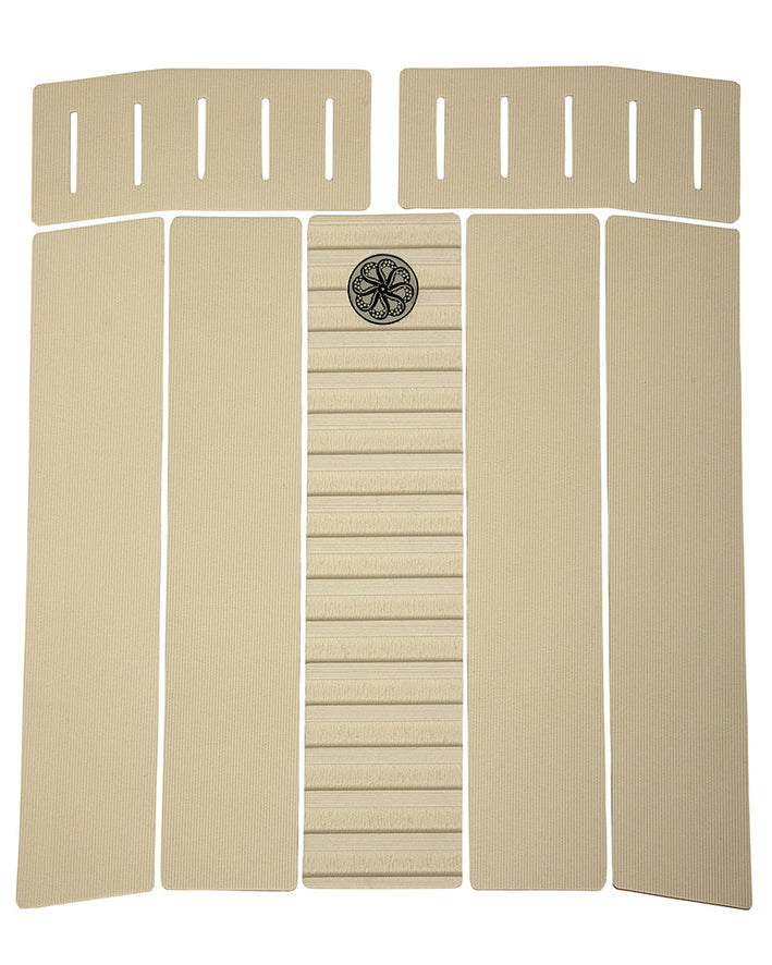 Beige 6-piece front deck grip with centre ridge, fine grooves and circular traction logo near the top