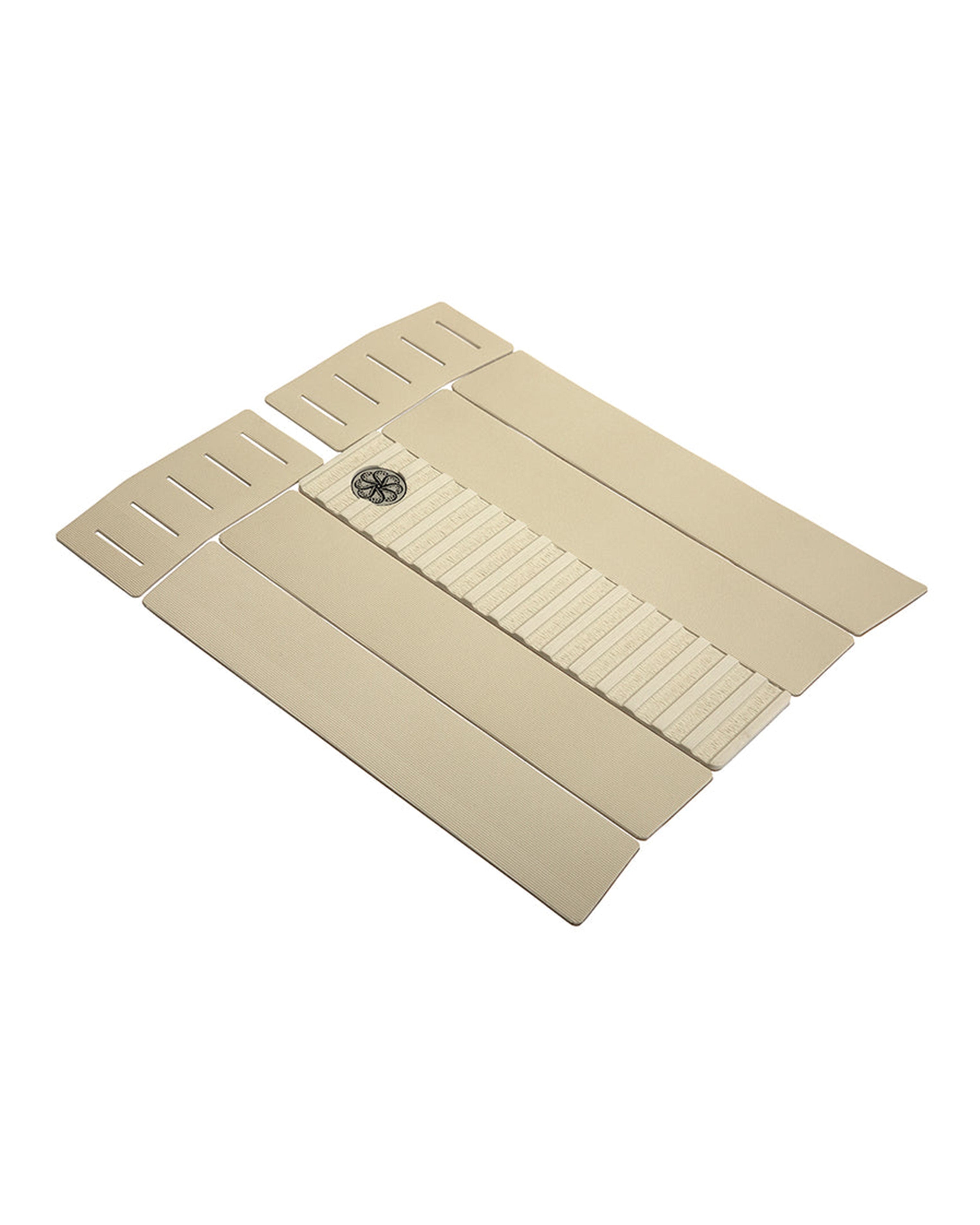 Angled view of beige front pad showing ribbed centre ridge and slotted upper grip panels