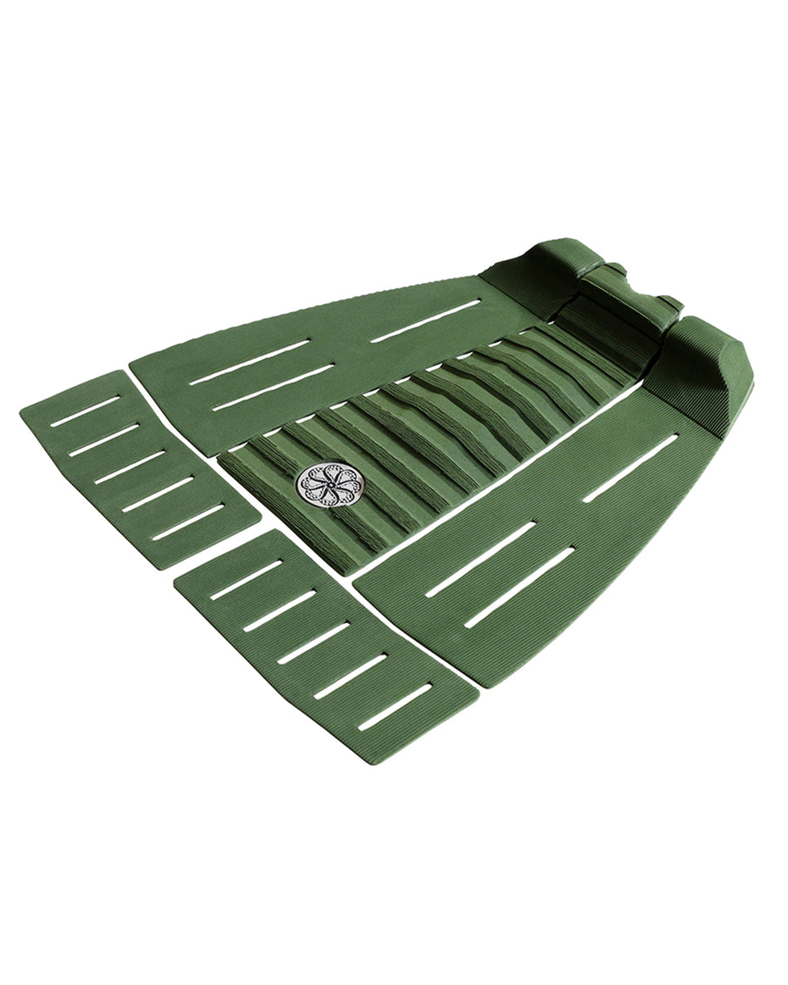 Side perspective of five-piece green grip pad with arch support and ribbed channels.