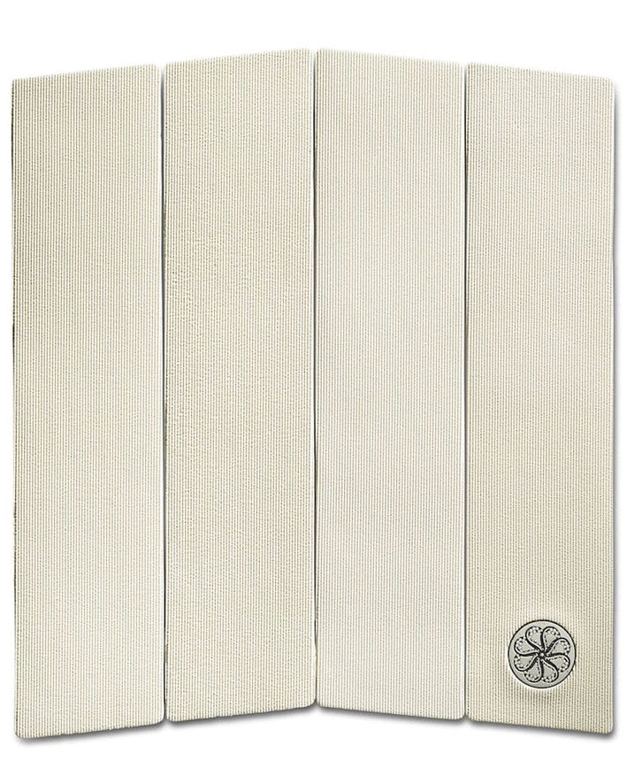 Four-piece white surfboard grip pad with ribbed texture and small logo on lower right panel.