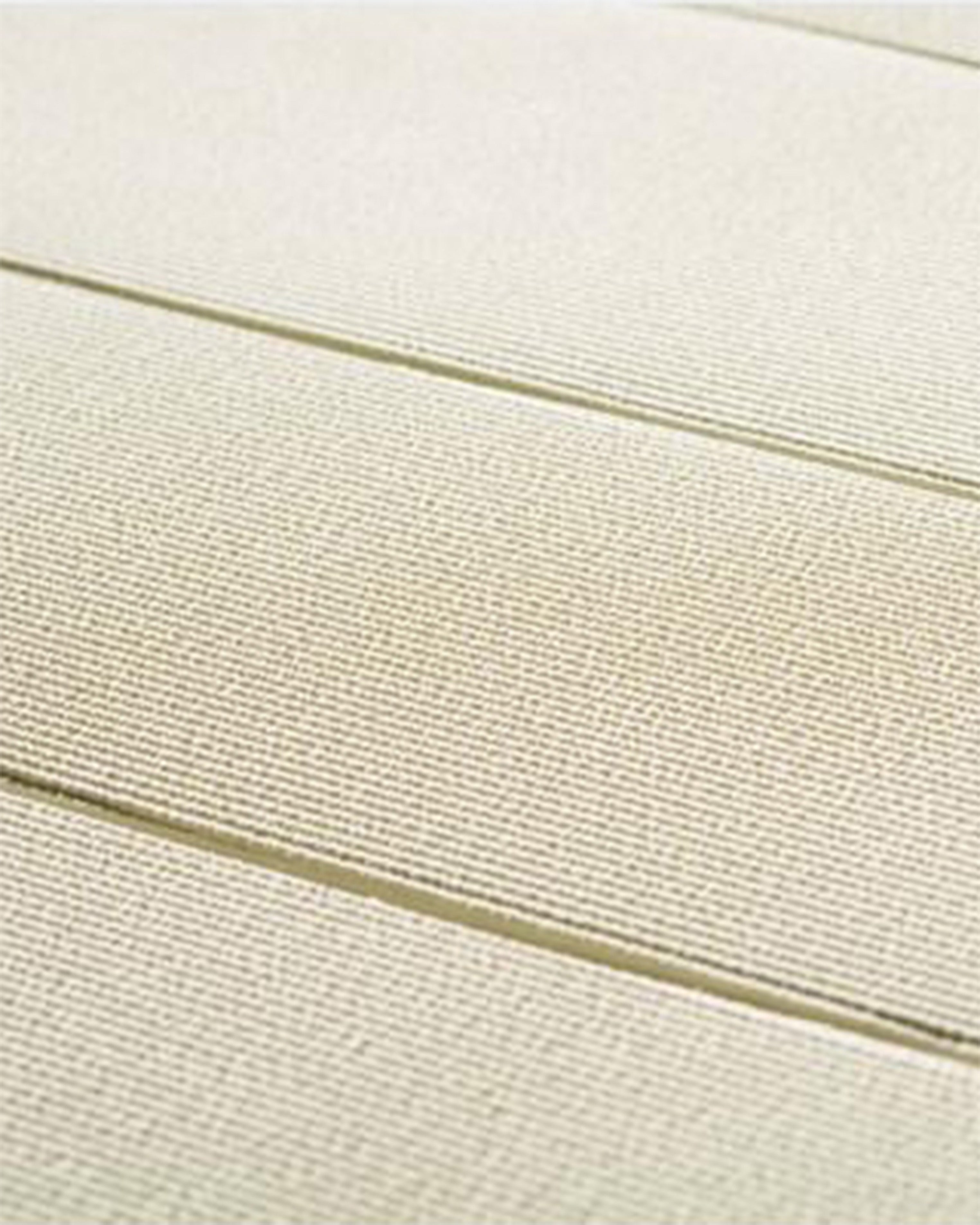 Close-up of beige fabric with horizontal stitching lines
