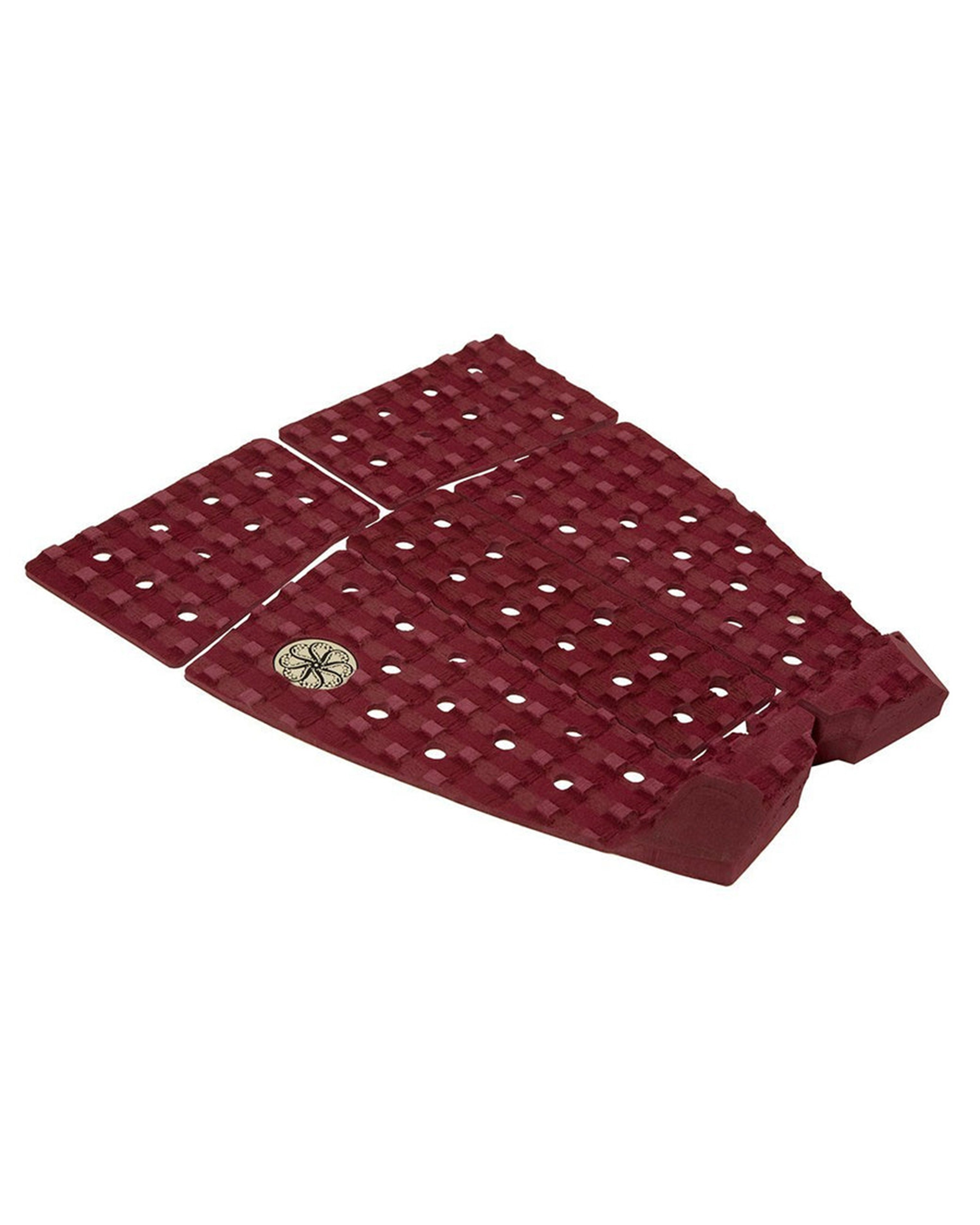 Angled view of maroon tail pad showing raised kick and grippy texture.