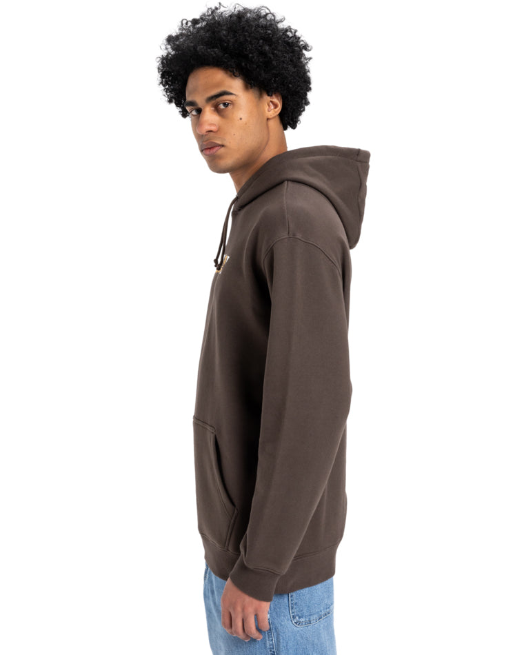Side view of a man wearing a brown Quiksilver hoodie with a front pocket and drawstring hood, paired with light blue jeans.