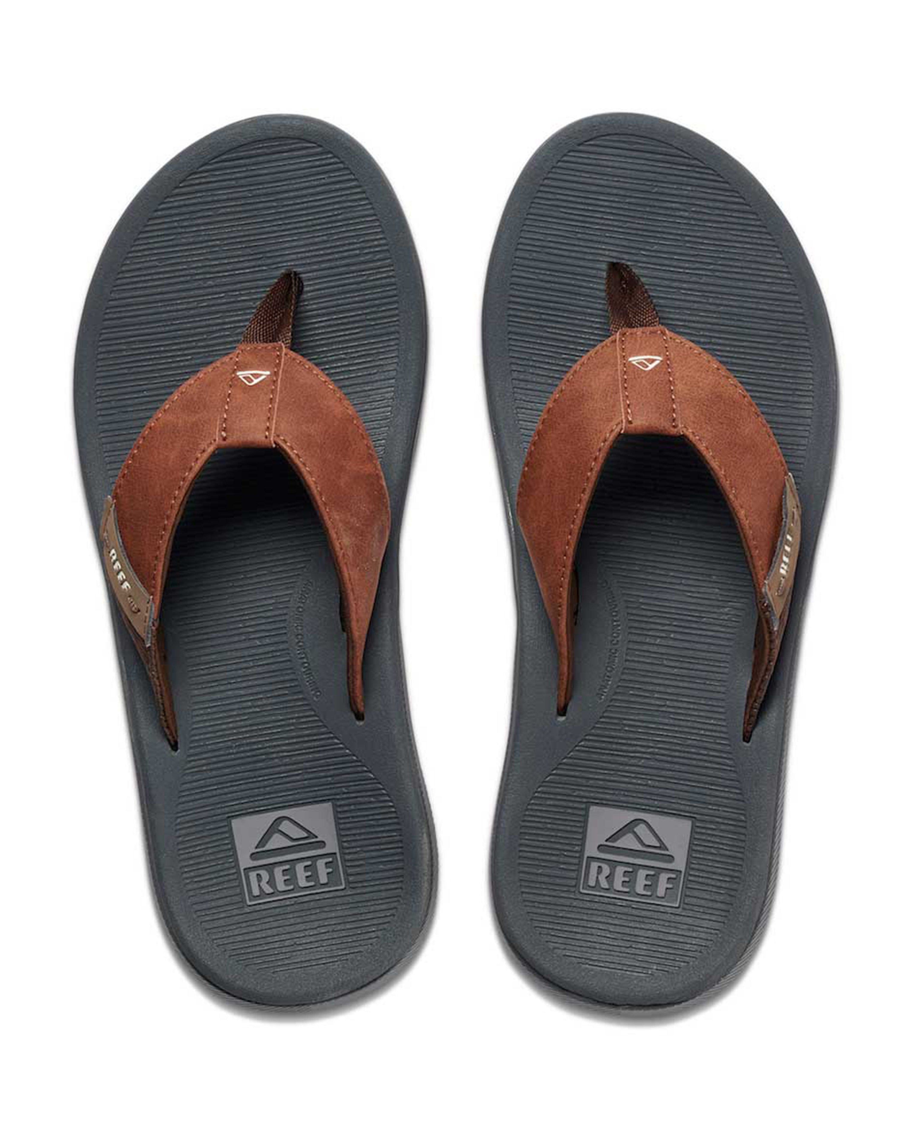 Top view of Reef thong sandals with brown straps and logo on footbed.