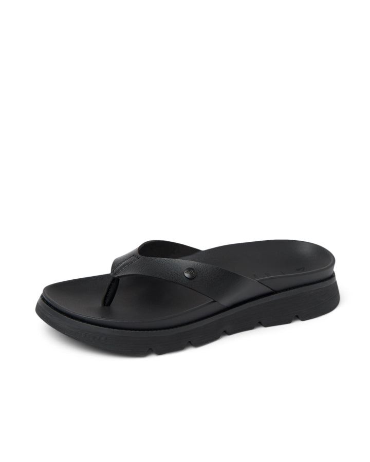 Angled view of black flip-flops with contoured footbed and raised outsole