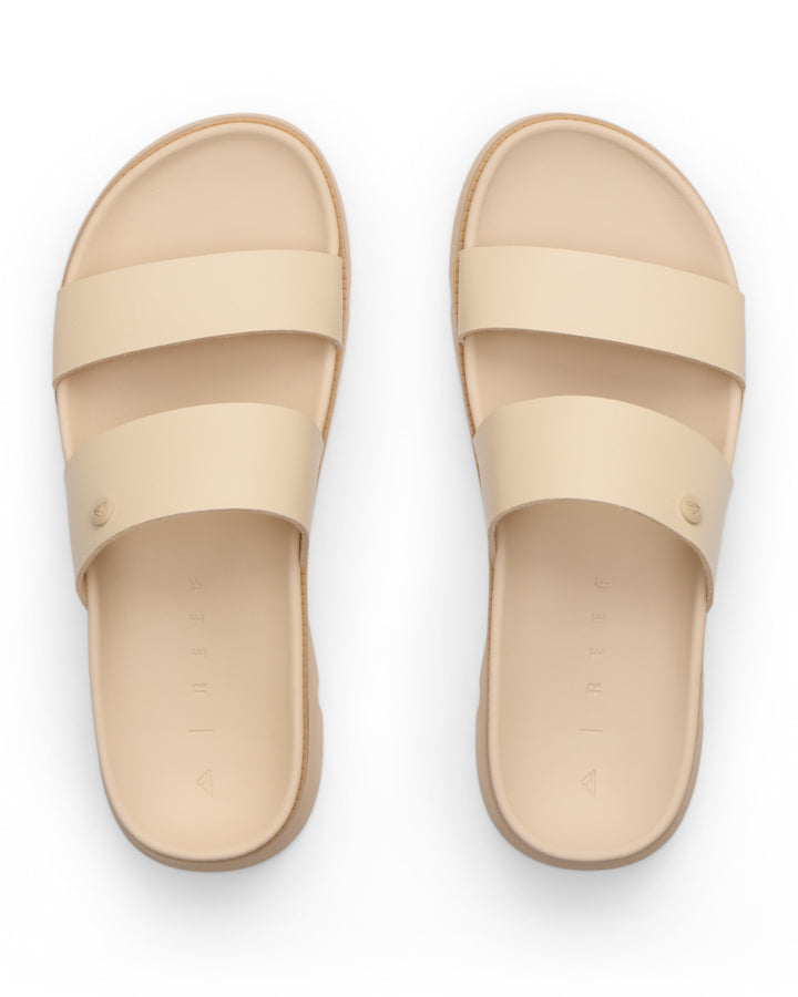 Top view of beige double-strap slide sandals with contoured footbed and minimalist design.