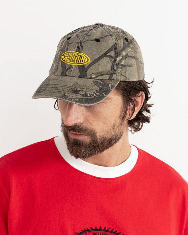 Camo Rhythm cap styled with red ringer tee, front logo visible