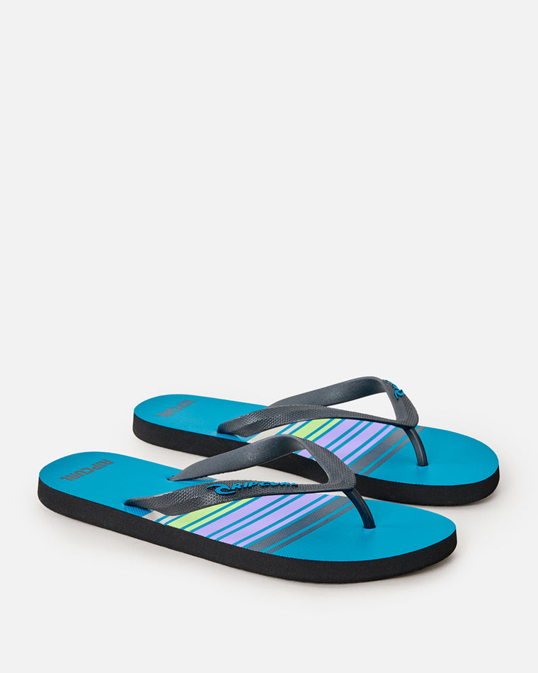 Blue Rip Curl thongs with multicolour striped footbed and black straps, angled side view