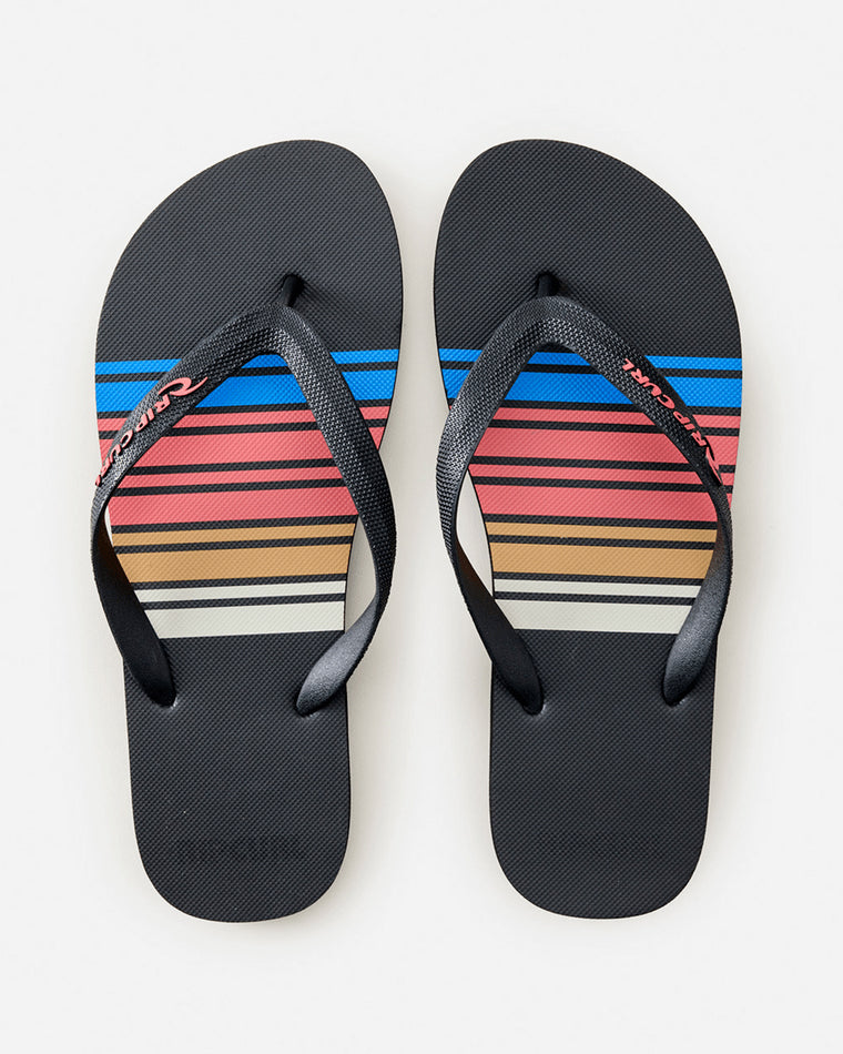 Top view of Rip Curl thongs with pink, red, yellow, and blue stripe design