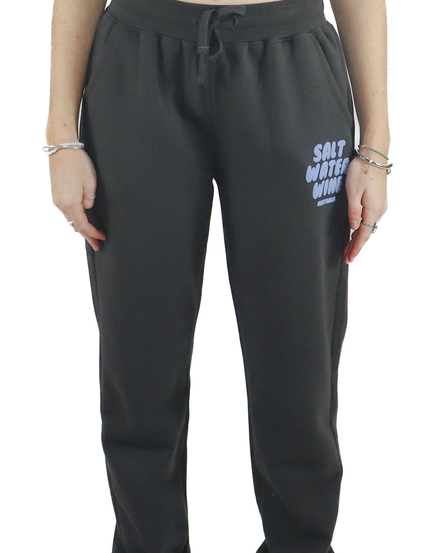 Charcoal fleece trackpants with Salt Water Wine logo in lilac on the left thigh, front view