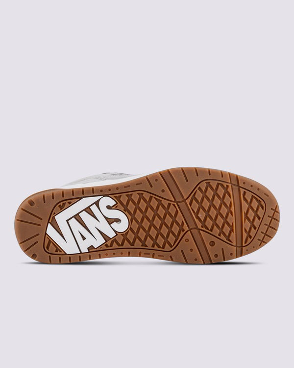 Bottom view of Vans sneaker showing gum waffle outsole with white Vans logo for grip and traction.