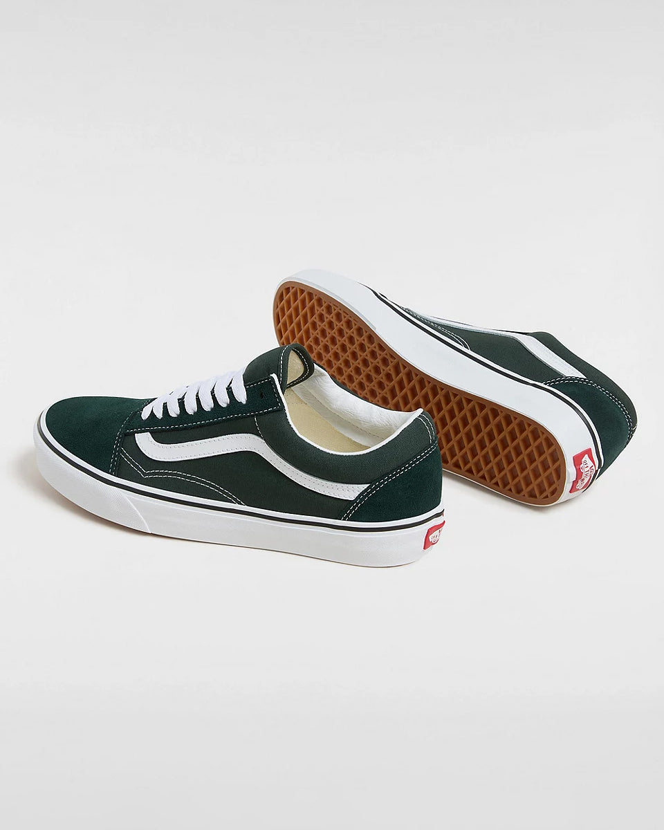 Pair of dark green Vans Old Skool sneakers with white laces, signature side stripe, and waffle soles, displayed on a white background.