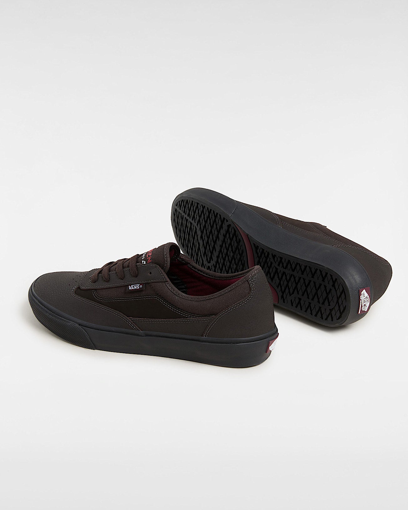 Vans brown skate shoes showing waffle sole tread and padded collar with red heel tag.