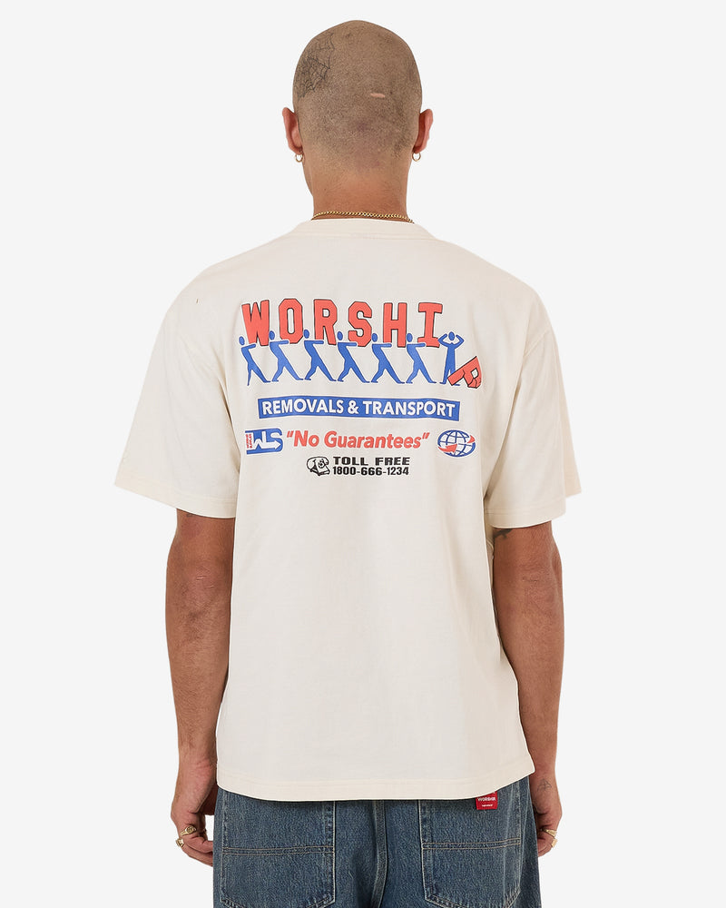 Cream short sleeve T-shirt with large blue and red Worship Removals & Transport graphic on the back.