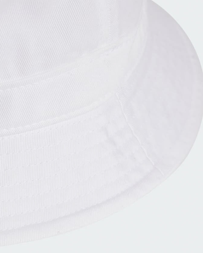 Close-up of white adidas bucket hat brim showcasing soft cotton fabric and detailed stitching.
