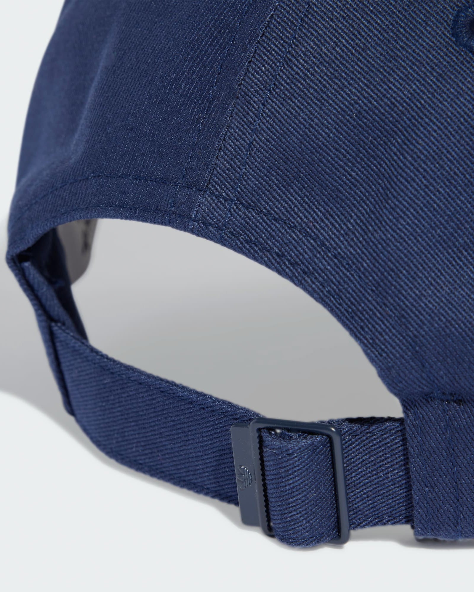 Rear view of navy Adidas cap featuring adjustable strap with metal buckle closure