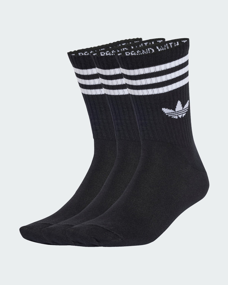 Three-pack of black adidas crew socks with white triple stripes and trefoil logo, made for comfort and sport style.