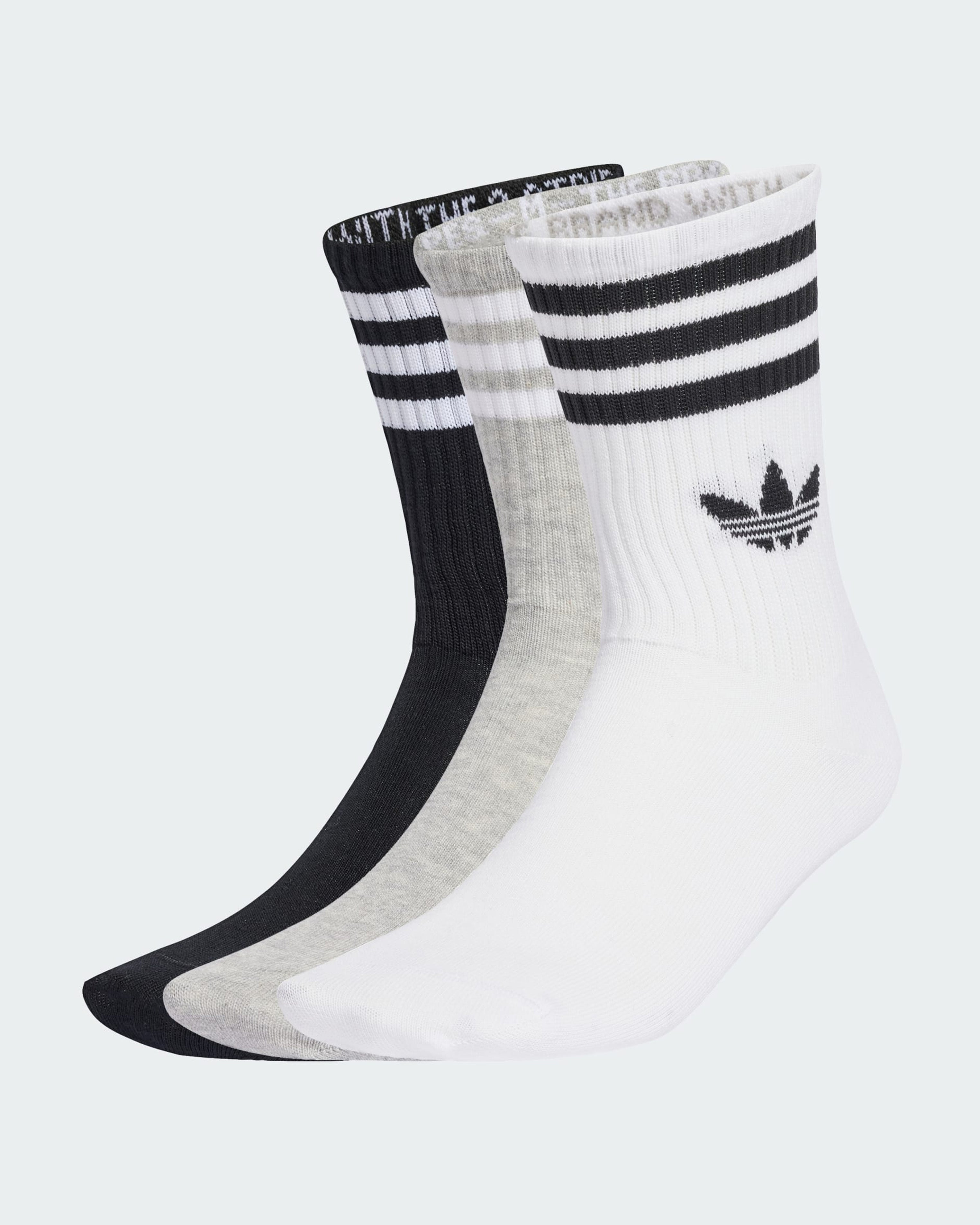 Three-pack of Adidas crew socks in white, grey and black with Trefoil logo and stripe detail.