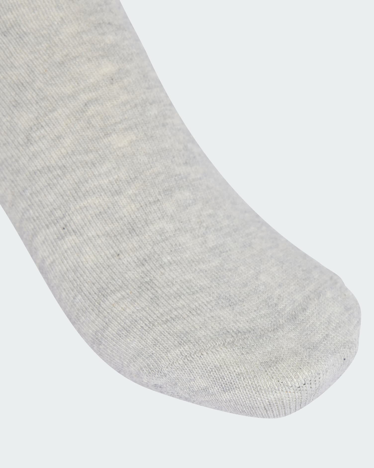 Close-up of grey Adidas sock toe showing soft ribbed fabric and seamless finish.