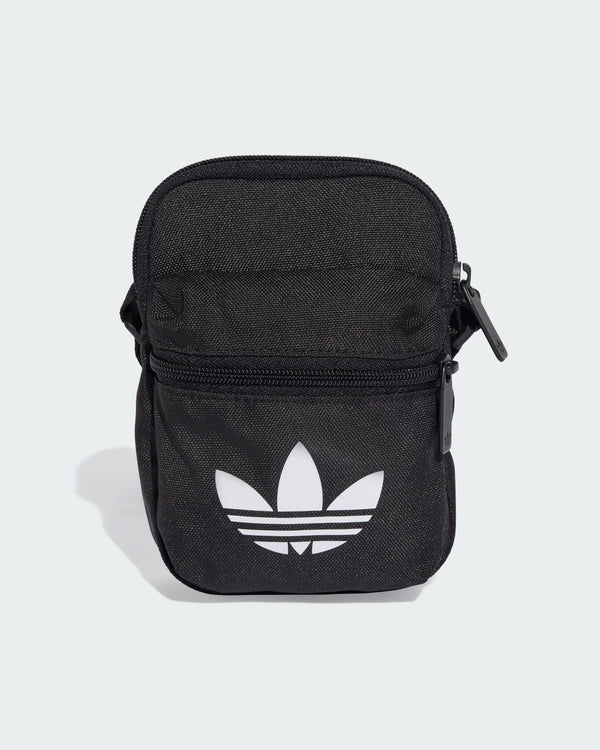 Black adidas Originals mini bag with white Trefoil logo and front zip pocket for small essentials.