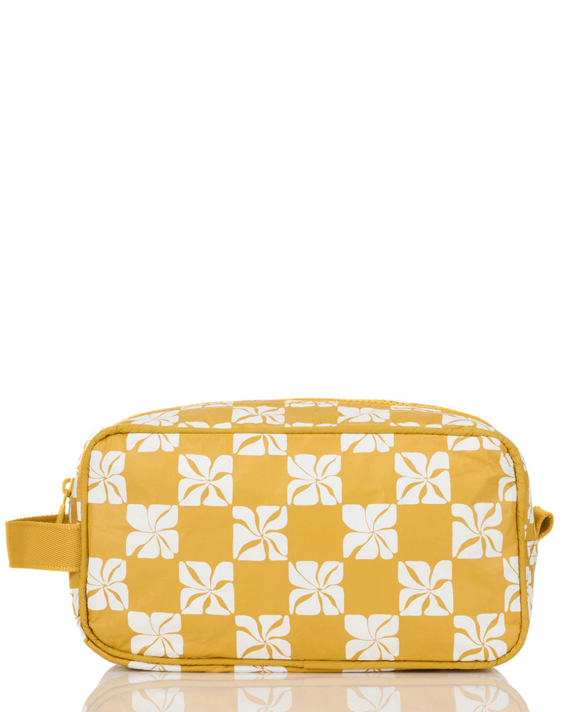 Yellow travel pouch with white floral checkerboard print and zip closure