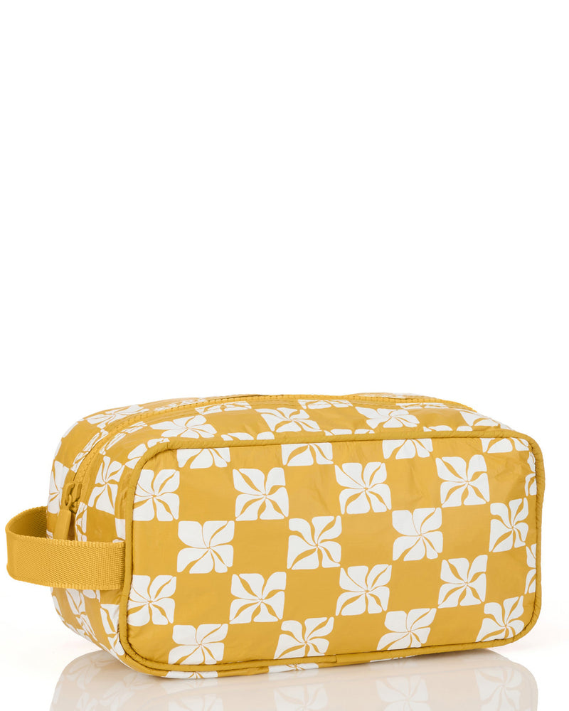 Side angle of yellow floral pouch with white checkerboard pattern and handle loop