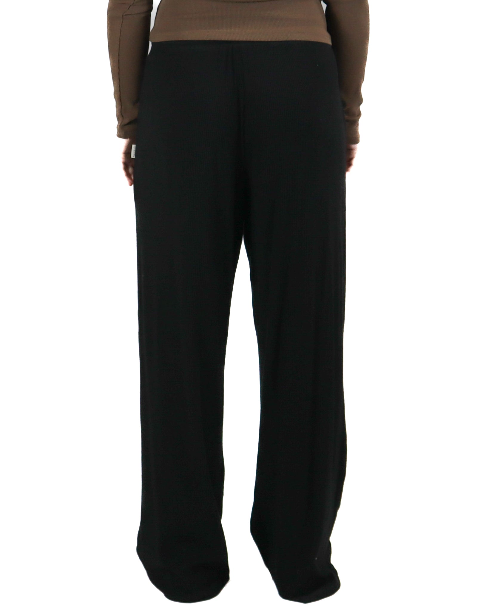 Rear view of black ribbed lounge pants with a relaxed fit and high waist