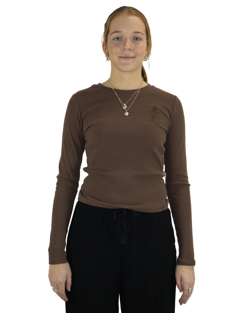 Fitted brown ribbed long sleeve top with Banksia embroidery, front view on model