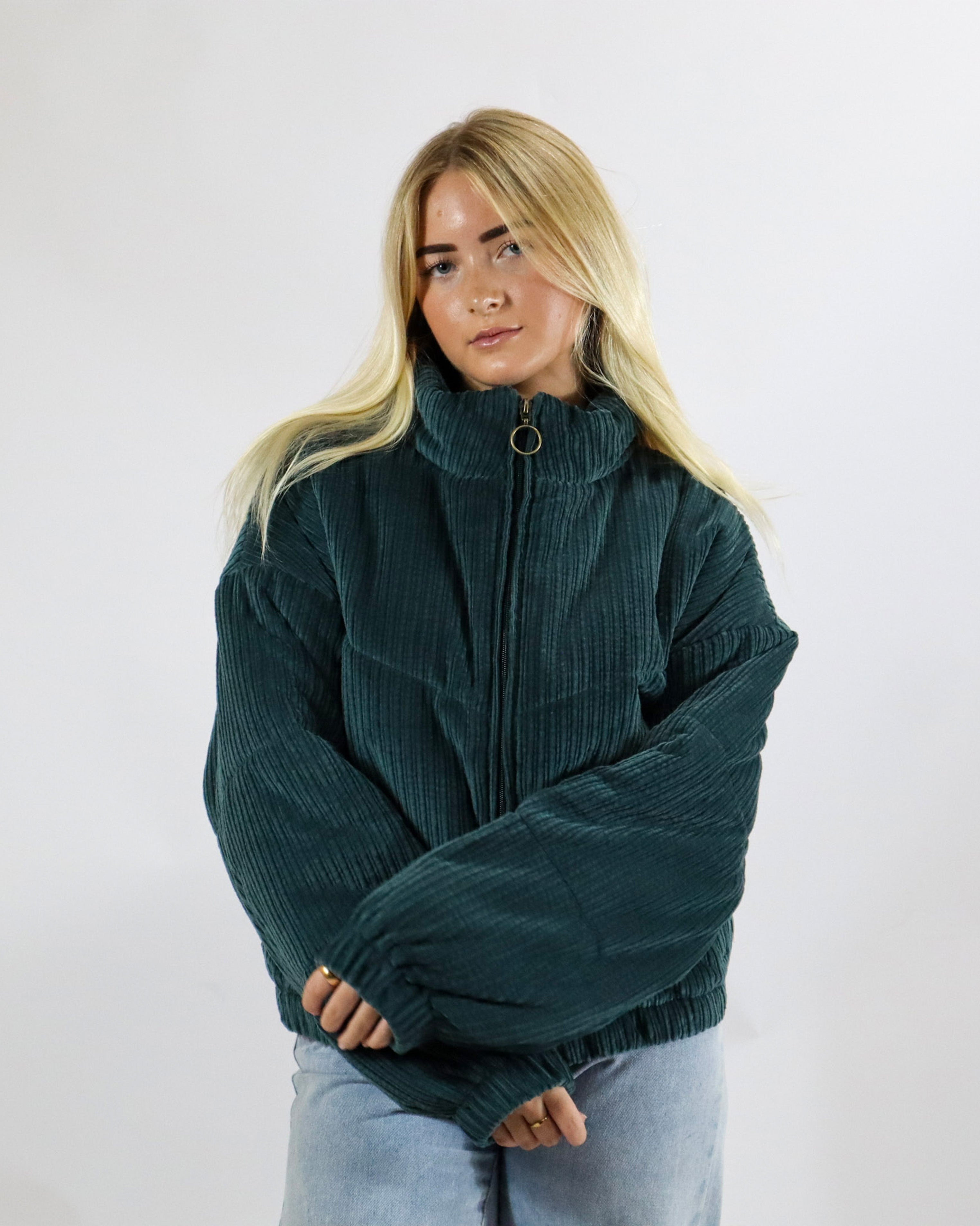 Women's dark green corduroy puffer jacket with zip front and high collar