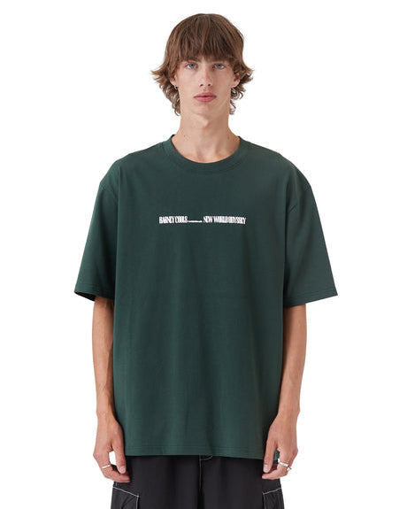 Dark green graphic t-shirt with small white chest print, front view on model.