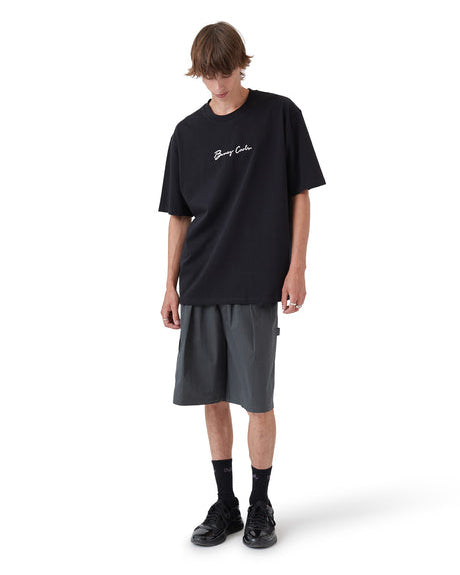 Full outfit featuring black logo tee, charcoal shorts, black crew socks and sneakers.