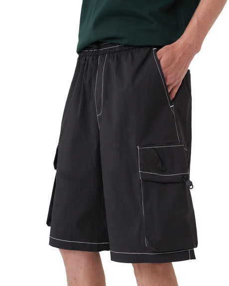 Front view of black cargo shorts with elastic waist and cargo pockets.