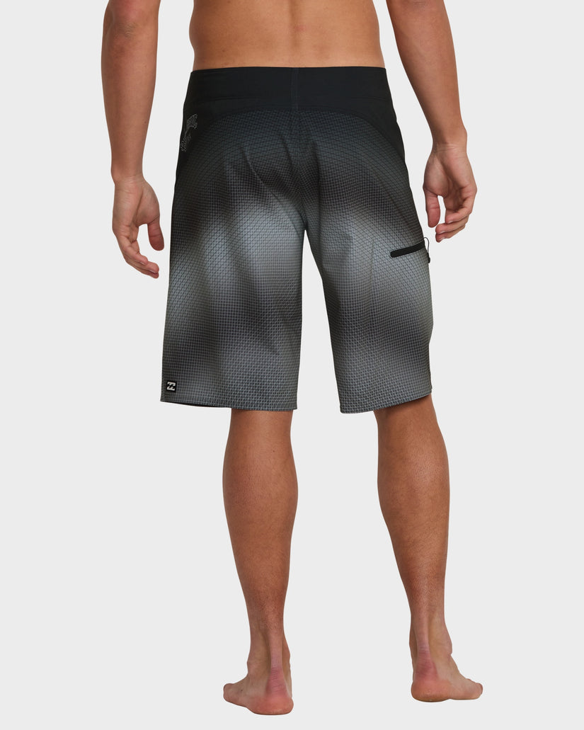 Gradient black boardshorts with a back pocket and logo near the hem, viewed from the back.