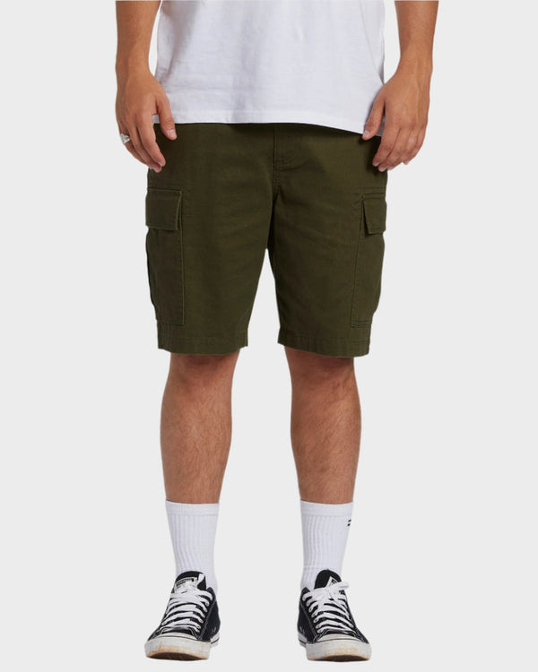 Men's olive green cargo shorts with front patch pockets, styled with black Converse and white socks.