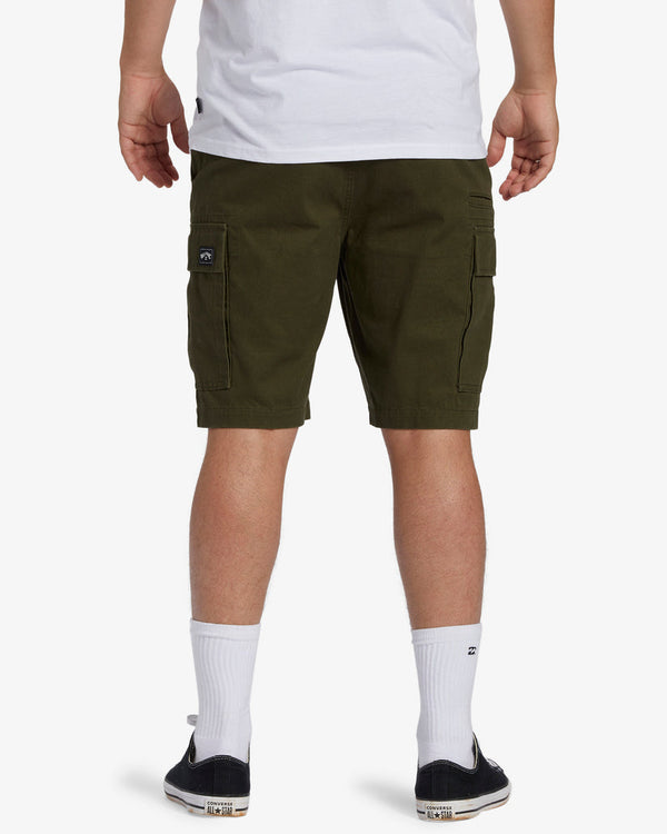 Back view of olive green cargo shorts with flap pockets and a small Billabong logo on the right side.