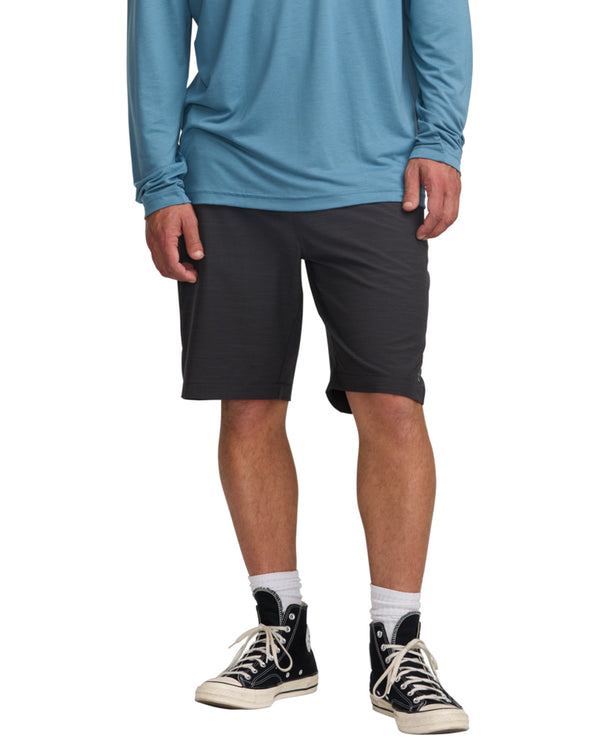 Men's charcoal knee-length shorts with subtle texture, styled with black Converse and white crew socks