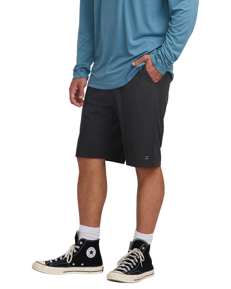 Side view of men's dark charcoal shorts with front pocket detail and casual fit.