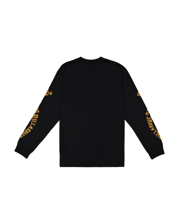 Back view of black long sleeve tee with yellow Billabong text on both arms