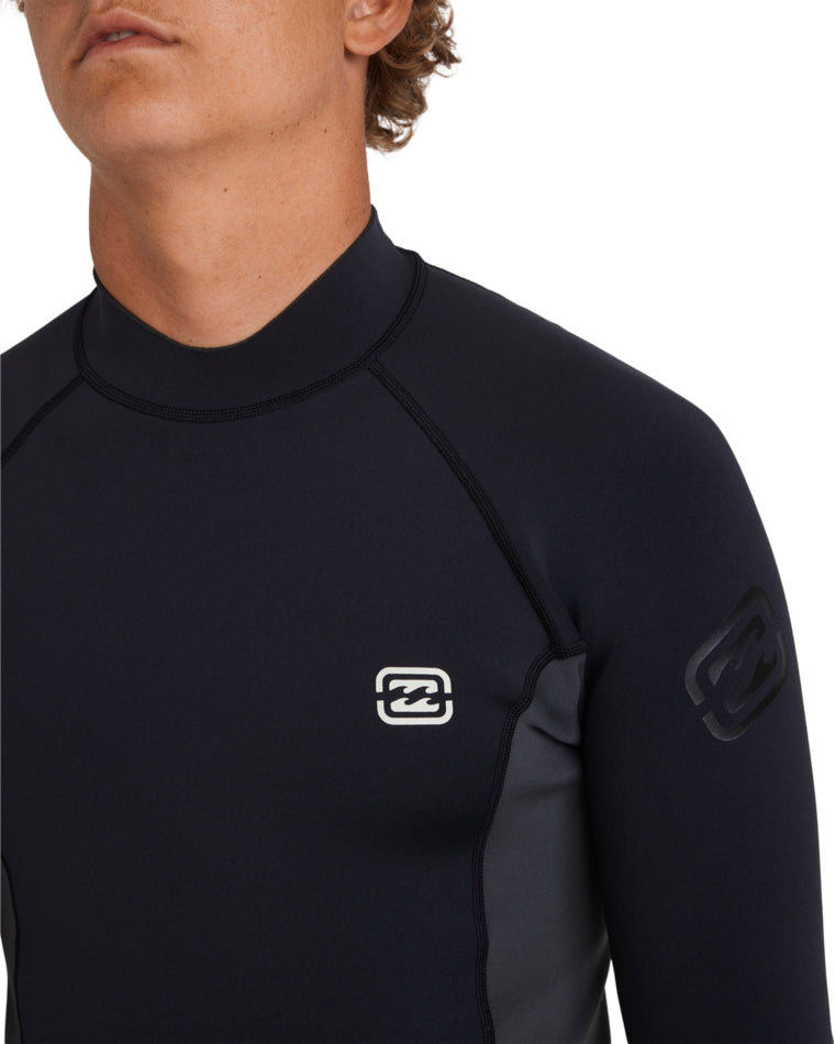 Close-up of black wetsuit material with logo on chest and upper arm.