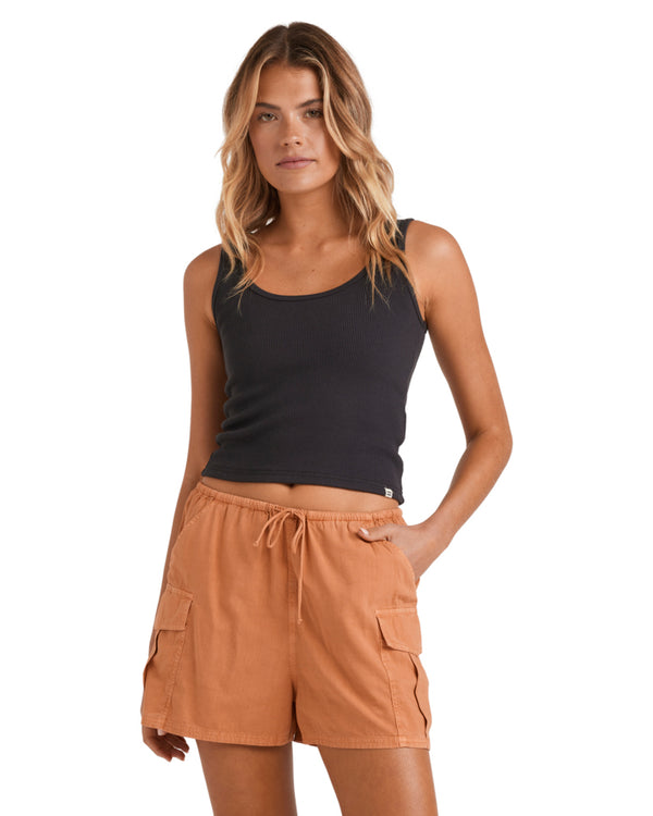 Black ribbed tank paired with rust-coloured drawstring cargo shorts