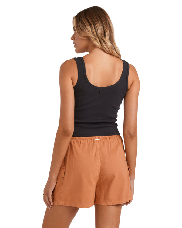 Back view of rust drawstring shorts and black scoop neck ribbed tank