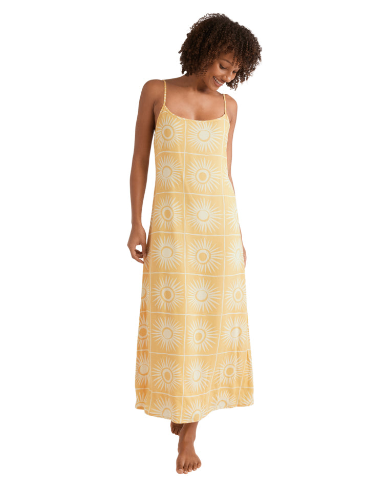 Yellow printed sleeveless dress with sunburst pattern and flowy hemline