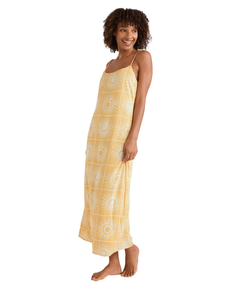 Side view of yellow sunburst slip dress with relaxed fit and ankle-length cut