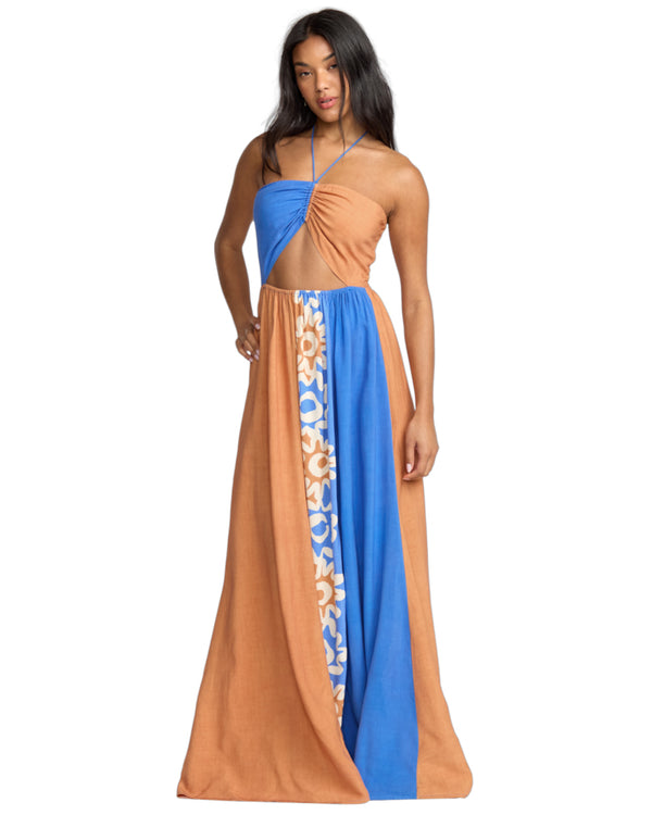 Front view of a cut-out halterneck maxi dress with blue and tan panels and floral detailing down the front.
